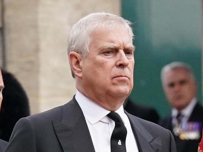 WINDSOR, ENGLAND - SEPTEMBER 19: Prince Andrew, Duke of York follows the State Hearse carrying the coffin of Queen Elizabeth II, draped in the Royal Standard with the Imperial State Crown and the Sovereign's Orb and Sceptre, as it arrives at the Committal Service held at St George's Chapel in Windsor Castle on September 19, 2022 in Windsor, England. The committal service at St George's Chapel, Windsor Castle, took place following the state funeral at Westminster Abbey. A private burial in The King George VI Memorial Chapel followed. Queen Elizabeth II died at Balmoral Castle in Scotland on September 8, 2022, and is succeeded by her eldest son, King Charles III. (Photo by Kirsty O'Connor - WPA Pool/Getty Images)