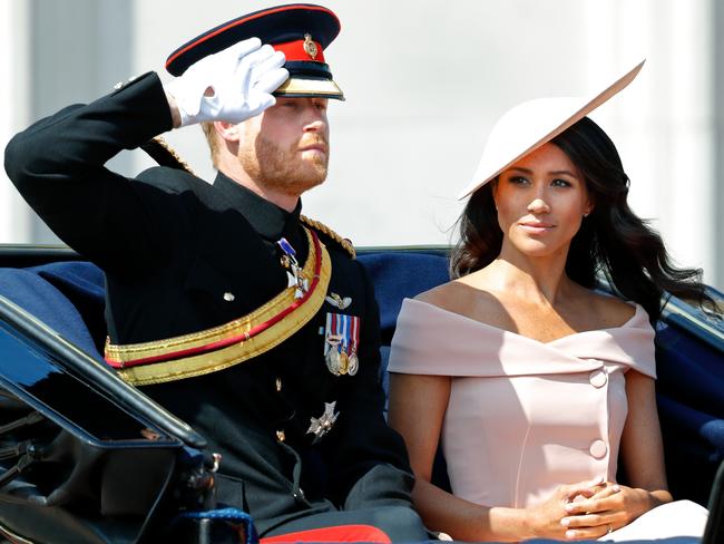 Prince Harry, Duke of Sussex and Meghan, Duchess of Sussex travel down The Mall in a horse drawn carriage during Trooping The Colour 2018 on June 9, 2018. Picture: Max Mumby/Indigo/Getty Images