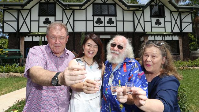 Founders of the beloved Tamborine Mountain Distillery have sold it after 25 years. New owners Gordon Chalmers and Shumei Hou and founders Michael and Alla Ward toasting the sale. Picture: Glenn Hampson