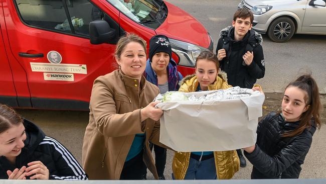 Local students present their homemade sandwiches for Ukrainian refugees in Kisvarda, eastern Hungary. Picture: Attila Kisbenedek/AFP