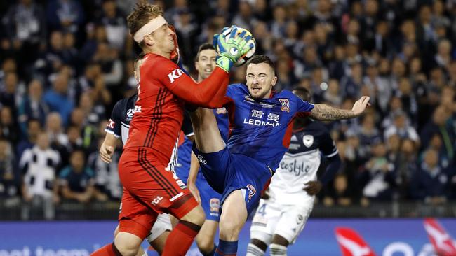 Roy O’Donovan kicks Lawrence Thomas in the face during last season’s A-League grand final. Picture: Toby Zerna