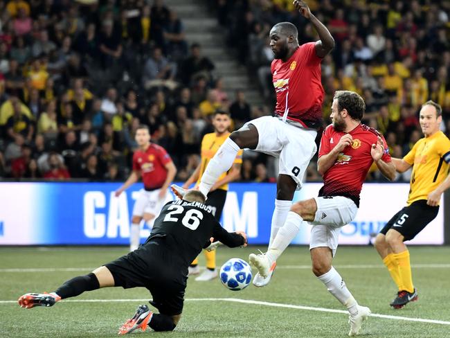 Manchester United's Belgian striker Romelu Lukaku (C) and teammate Spanish midfielder Juan Mata (2R) fight for the ball with Young Boys Swiss goalkeeper David von Ballmoos. Picture: AFP