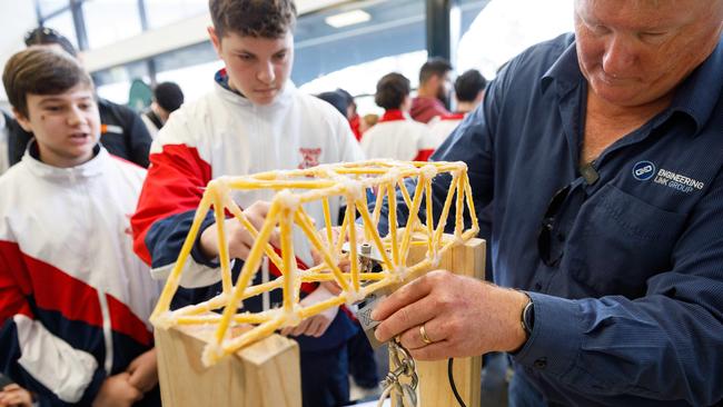 In this picture Greg Millican of Engineering Link Group sets up the weight testing device on a design from Marist College Kogarah. Picture by Max Mason-Hubers