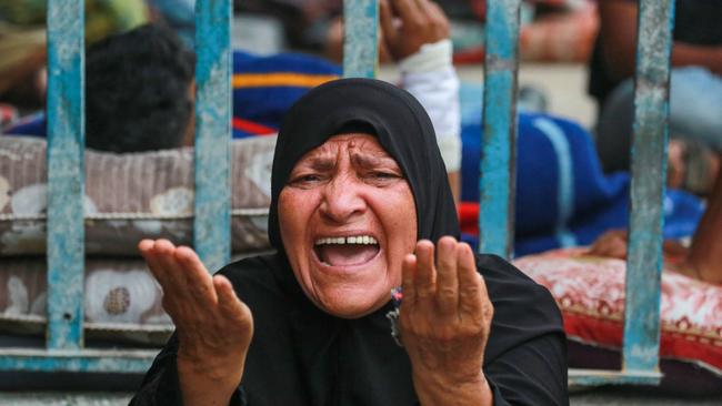 An emotional Palestinian woman reacts to Israel’s latest attack.