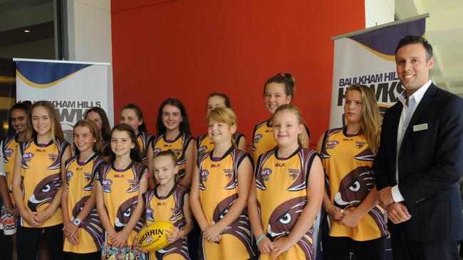 The Baulkham Hills Hawks Youth Girls with Novotel Sydney Norwest's Mark Newey at the season launch on March 19.