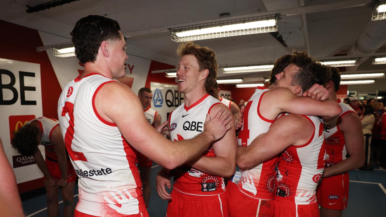 SYDNEY, AUSTRALIA – JULY 13: Callum Mills of the Swans celebrates victory with teammates after the round 18 AFL match between Sydney Swans and North Melbourne Kangaroos at SCG, on July 13, 2024, in Sydney, Australia. (Photo by Matt King/Getty Images)