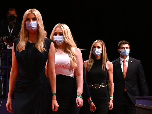 Mr Trump’s daughters, from left, Ivanka and Tiffany with son Eric Trump's wife Lara arriving for the debate. Picture: AFP