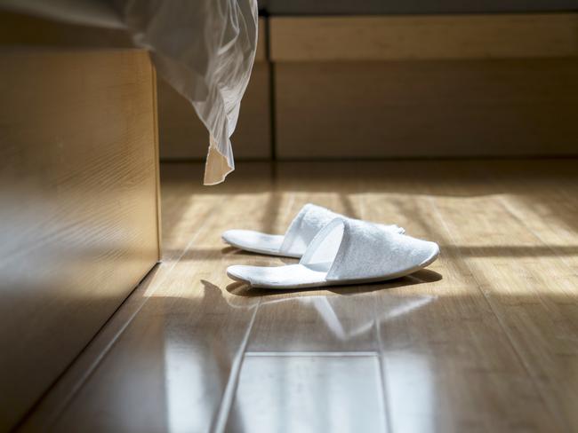 slippers on floor at hotel