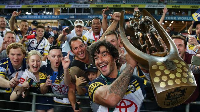 Johnathan Thurston didn’t need a second invitation to ice the Cowboys’ first premiership in Golden Point. Picture: Brett Costello