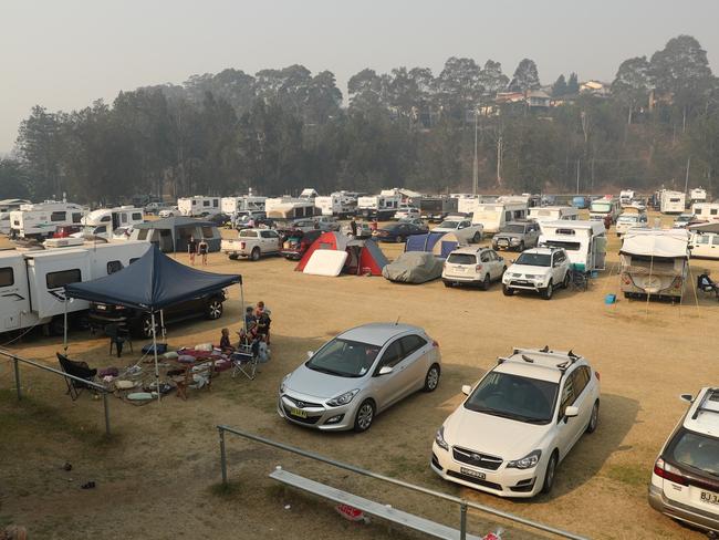 People have been sleeping in their vehicles to shelter from the bushfires threatening their tow. Picture: John Grainger