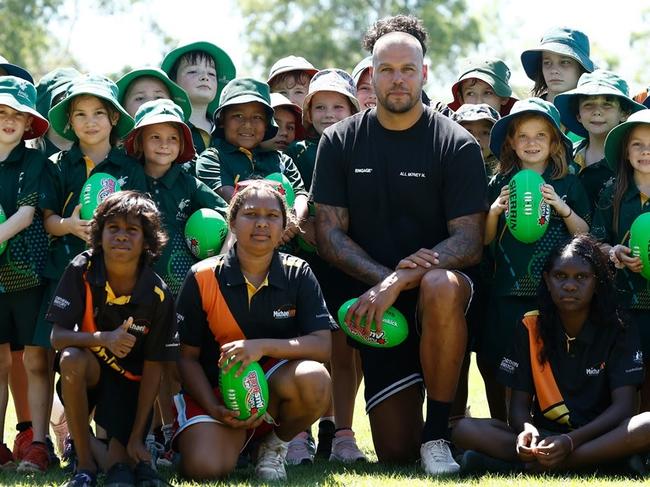 Lance Buddy Franklin poses for a photograph with students from Anula Primary School and the Michael Long Learning and Leadership Centre during an AFL media opportunity at Anula Primary School on May 15, 2024 in Darwin, Australia. (Photo by Michael Willson/AFL Photos)