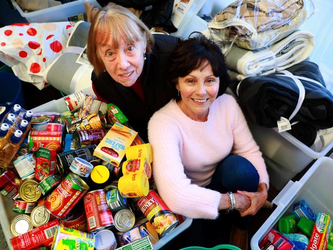 77 year old Heather Stephens and 69 year old Margaret Abel pose for photographs with donated items at Guild Leagues Club. Guildford, Monday, July 16th 2018. Margaret has been a member of the Guild Leagues Club for many years She has spearheaded the campaign at the club to donate items to Youth off the street and Exodus. (AAP Image / Angelo Velardo)