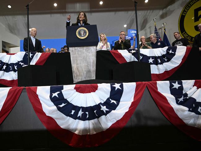 US President Joe Biden (L) listens as US Vice President and Democratic presidential candidate Kamala Harris (C) speaks during a campaign rally at the International Brotherhood of Electrical Workers (IBEW) Local 5 in Pittsburgh, Pennsylvania. Picture: AFP