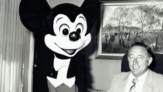 Mayor Denis O'Connell in his office with Mickey Mouse.