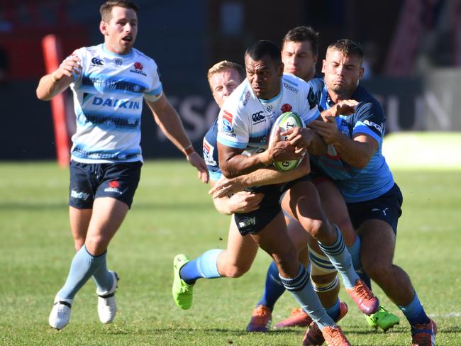 PRETORIA, SOUTH AFRICA - MAY 04: Kurtley Beale of the Waratahs tackled by Dylan Sage of the Bulls during the Super Rugby match between Vodacom Bulls and Waratahs at Loftus Versfeld on May 04, 2019 in Pretoria, South Africa. (Photo by Lee Warren/Gallo Images)