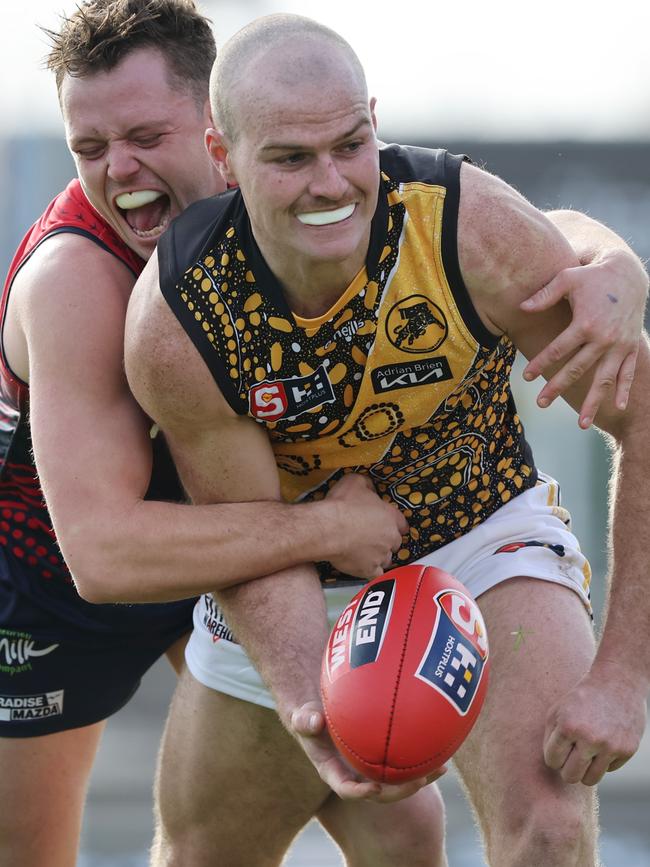 Glenelg’s Cole Gerloff is tackled by Norwood’s Cory Stockdale in the Tigers’ five-goal win at The Parade. Picture: David Mariuz (SANFL)