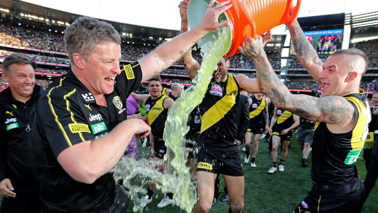 2019 AFL Grand Final. 28/09/2019.     during the 2019 AFL Grand Final match between the Richmond Tigers and the GWS Giants at the MCG on September 28, 2019 in Melbourne, Australia. Dustin Martin pours the Gatorade bin over coach Damien Hardwick.Picture: Michael Klein.