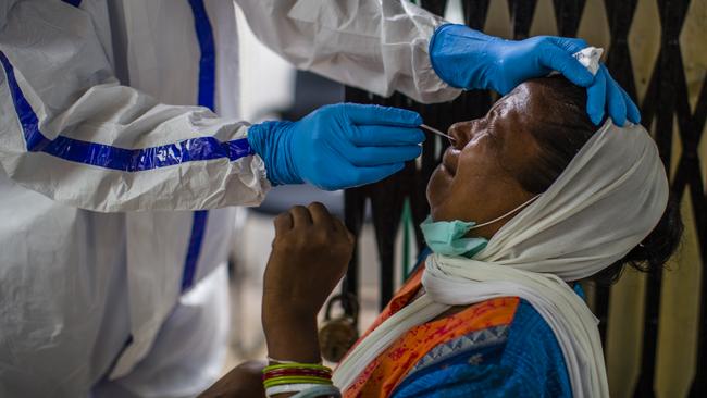 A woman has a coronavirus test in New Delhi. Picture: Getty Images