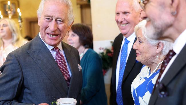 Britain's King Charles III reacts whilst holding a cup and saucer, as he meets with guests during a 75th birthday party for him, hosted by the Prince's Foundation, at Highgrove House in Tetbury, western England on November 13, 2023. Guests included local residents who have been nominated by friends and family and individuals and organisations also turning 75 in 2023. (Photo by Chris Jackson / POOL / AFP)