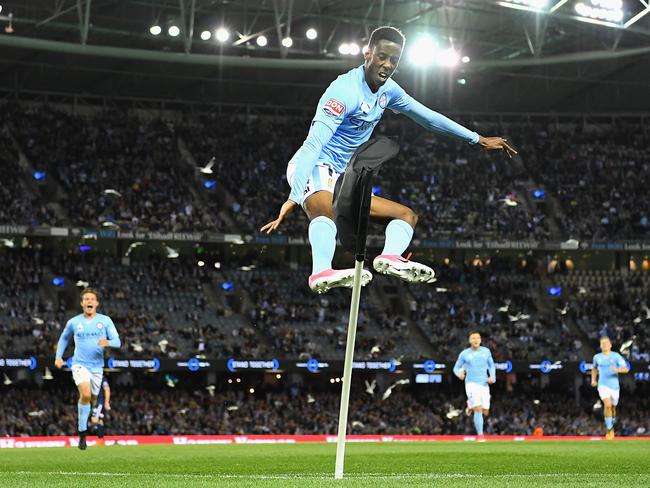 MELBOURNE, AUSTRALIA - OCTOBER 14:  Bruce Kamau of the City celebrates scoring a goal by kicking over the corner flag during the round two A-League match between Melbourne Victory and Melbourne City FC at Etihad Stadium on October 14, 2017 in Melbourne, Australia.  (Photo by Quinn Rooney/Getty Images)