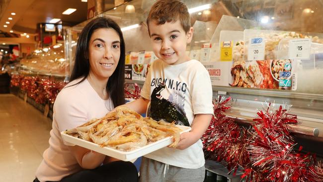 Jordana Shell and her son Cooper (4) shopping for prawns at Coles Bondi Junction. Picture: Richard Dobson.