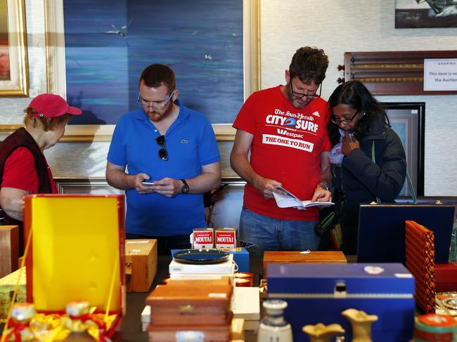 Members of the public inspecting the hundreds of items up for auction. Picture: Sam Ruttyn