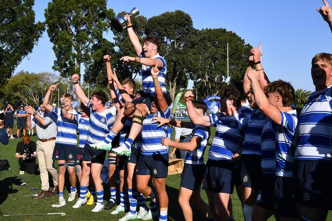 John Grenfell (on the shoulders of Isaac Rauluni) raises the GPS premiership trophy in 2024. Picture, John Gass