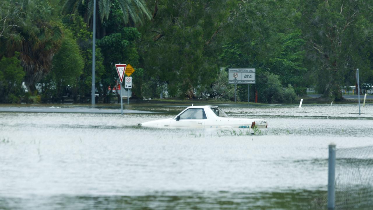 Flooded cars in the general aviation area of Cairns Airport after flood water from ex Tropical Cyclone Jasper caused severe flooding in Cairns, Far North Queensland. Raw sewage could be in flood waters near Cairns Airport due to the nearby sewage treatment plant at Aeroglen. Picture: Brendan Radke