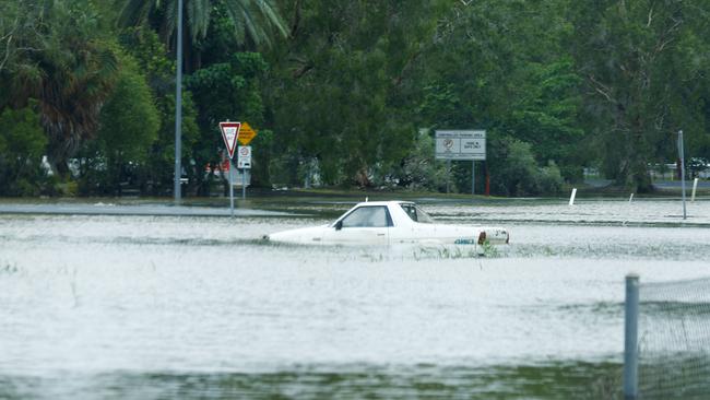 Flooded cars in the general aviation area of Cairns Airport after flood water from ex Tropical Cyclone Jasper caused severe flooding in Cairns, Far North Queensland. Raw sewage could be in flood waters near Cairns Airport due to the nearby sewage treatment plant at Aeroglen. Picture: Brendan Radke