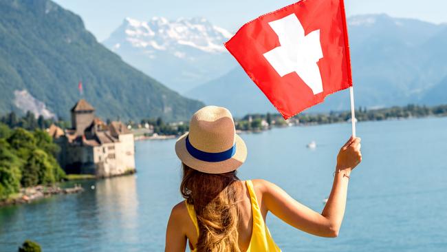 Are the Swiss turning their backs on neutrality? A young traveller enjoys the view over Switzerland’s famed Lake Geneva. Picture: iStock