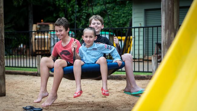 Archie, Albie and Harry Maclean from Orange, New South Wales at the Mission Beach Hideaway Holiday Village playground. during school holidays. Their dad Andy says more tour offerings at Mission Beach would have been ideal. Picture: Arun Singh Mann