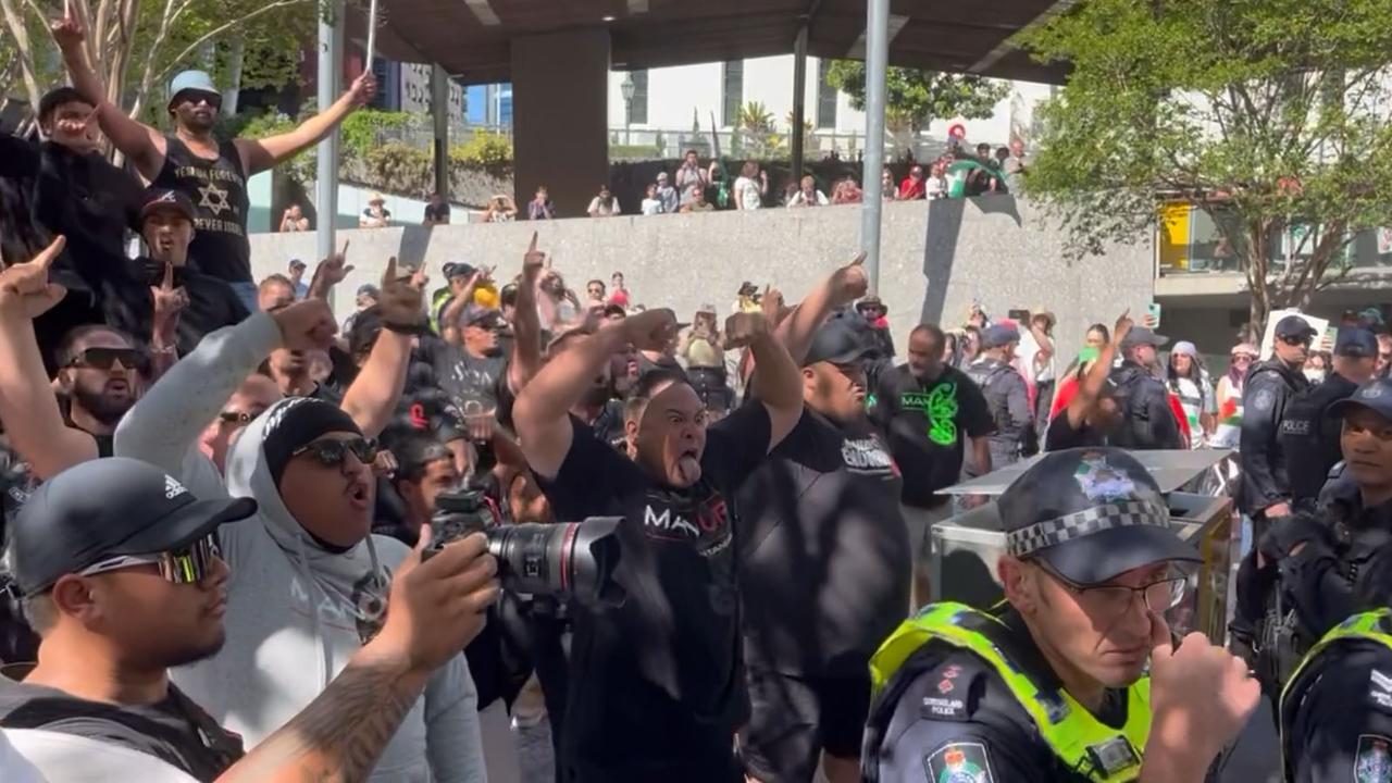 A group performs the haka at the pro-Palestine rally while surrounded by police. Picture: Liam Kidston