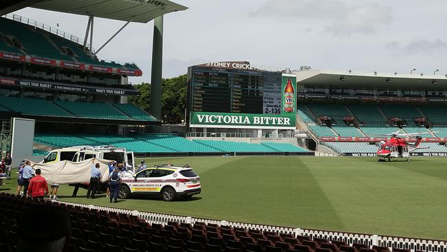 A helicopter and an ambulance arrived at the SCG to transport Phillip Hughes to the hospital. Picture: Mark Metcalfe/Getty Images