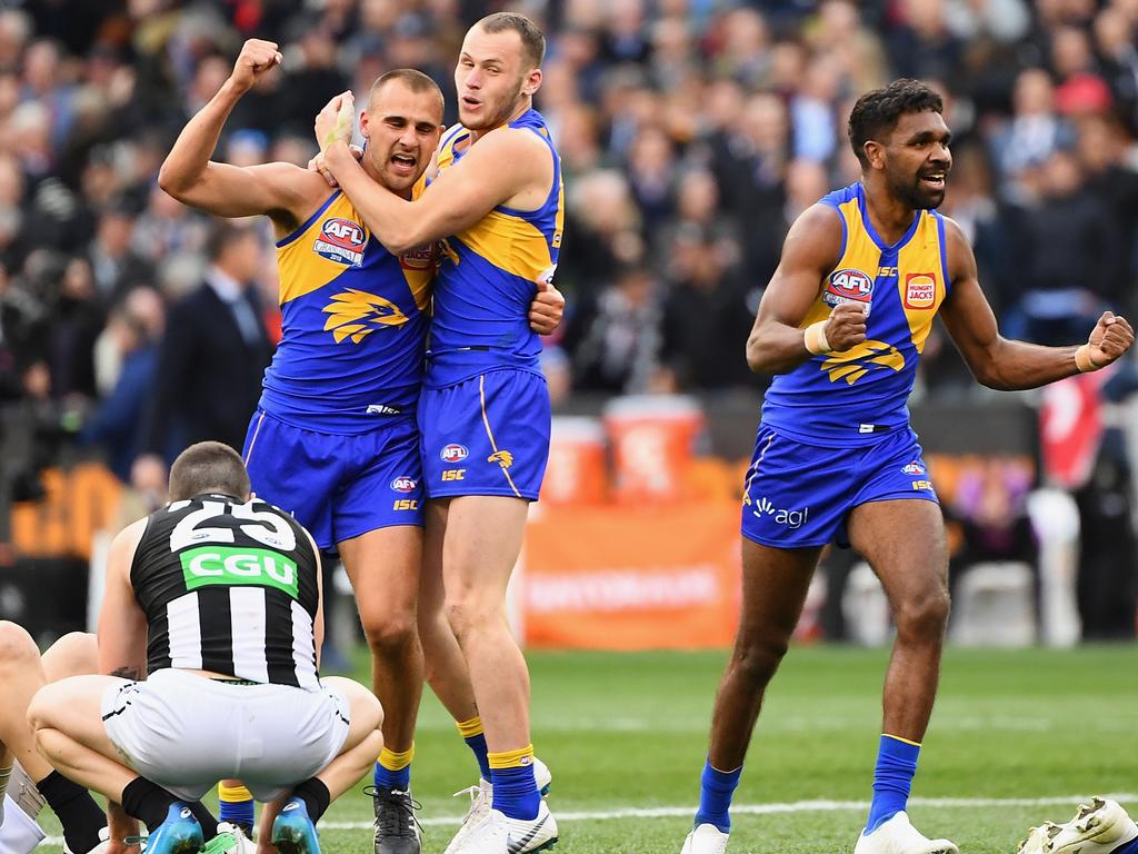 Dom Sheed and his Eagles teammates celebrate winning the AFL Grand Final.