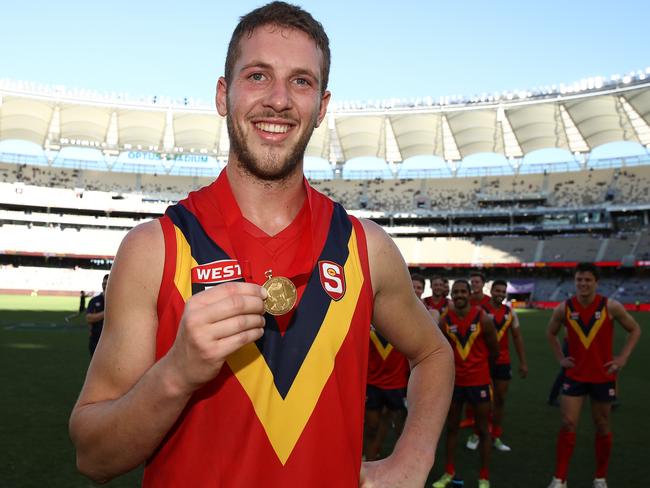 PERTH, AUSTRALIA - MAY 12: Michael Knoll of the SANFL poses with the Foss-Williams medal for best SANFL player during the state game between WA and SA at Optus Stadium on May 12, 2019 in Perth, Australia. (Photo by Paul Kane/Getty Images)