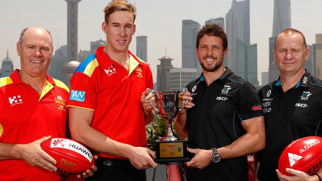 Gold Coast coach Rodney Eade and co-captain Tom Lynch with their Port Adelaide counterparts Travis Boak and Ken Hinkley. The Suns may well not be back for a reprise of their historic Shanghai clash. Picture: Michael Willson (AFL Media/Getty Images)