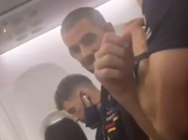 Luke Brown and Taylor Walker seen without masks on their flight to Adelaide.