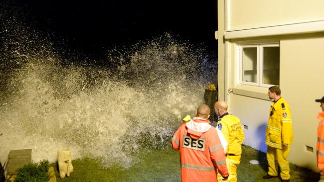 Emergency services sandbag the front of an apartment building at Collaroy on Sydney's Northern Beaches as the king tide peaks. Picture: Jeremy Piper.