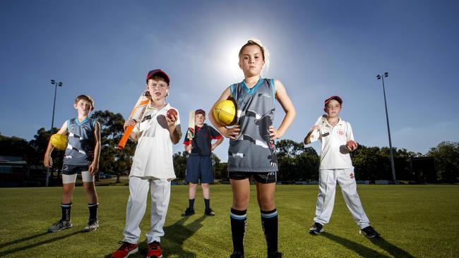 Surrey Park junior cricketers and footballers Harry Grant, Marco van der Pligt, Barnaby Smith, Zara Phan and Luke Macey at The Surrey Park oval in Box Hill Picture: David Geraghty