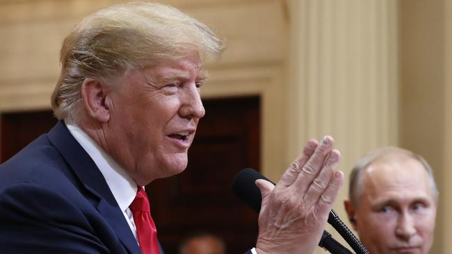 U.S. President Donald Trump speaks with Russian President Vladimir Putin during a press conference after their meeting at the Presidential Palace in Helsinki, Finland, Monday, July 16, 2018. (AP Photo/Pablo Martinez Monsivais)