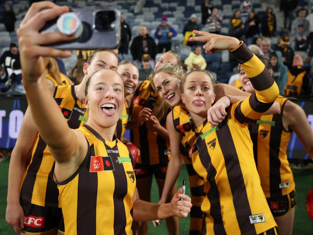 GEELONG, AUSTRALIA – SEPTEMBER 26: Jasmine Fleming of the Hawks takes a selfie with teammates after winning the round five AFLW match between Geelong Cats and Hawthorn Hawks at GMHBA Stadium, on September 26, 2024, in Geelong, Australia. (Photo by Daniel Pockett/AFL Photos/via Getty Images)