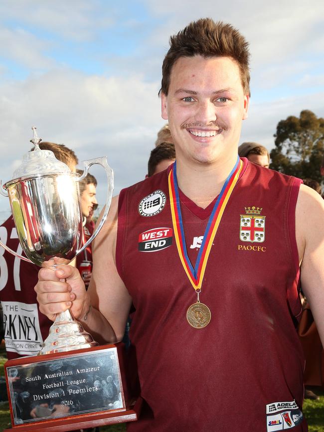 Hayden Jolly with the Old Reds’ 2016 division one premiership cup. Picture: Stephen Laffer