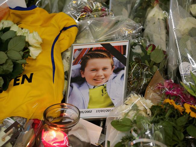 A photograph of a young boy lies among tributes at the entrance to Schiphol Airport, which has grown into a sea of flowers in memory of the victims of Malaysia Airlines flight MH17. Pic: Christopher Furlong/Getty Images