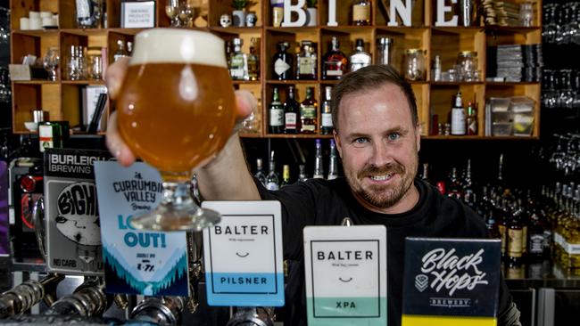 Bine Beer and bar owner Scott Imlach, pouring a beer. Picture: Jerad Williams