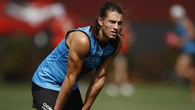 Archie Perkins catches his breath on day one of Essendon pre-season training.