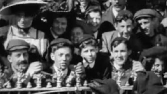 A crowd of 37,000 people sit enthralled at the 1909 VFL grand final between South Melbourne and Carlton. Picture: National Film and Sound Archive