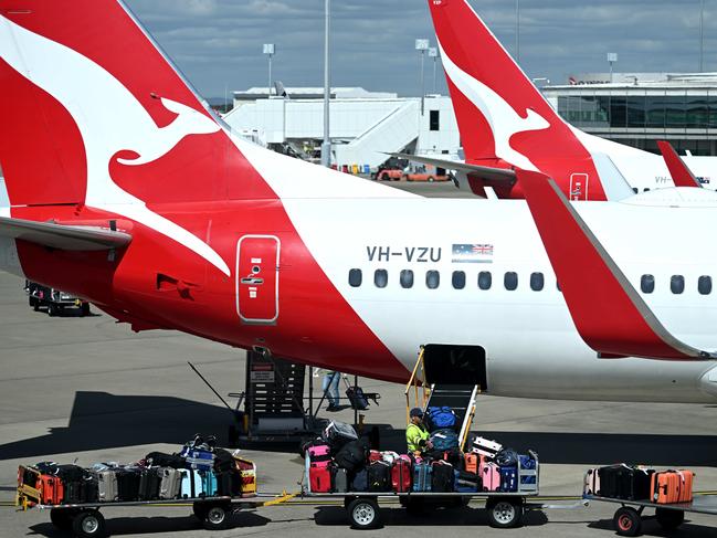 BRISBANE, AUSTRALIA - NewsWire Photos - AUGUST 11, 2022. Qantas baggage handlers at work at Brisbane airport. Industrial action will start at Qantas and budget offshoot Jetstar by the end of August amid an escalating fight over pay with its licensed engineers.Picture: NCA NewsWire / Dan Peled