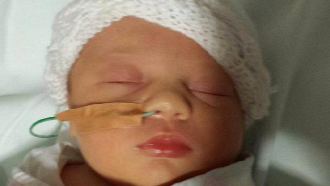 Baby Ava was born after mum Ashley Buchanan underwent an emergency C-section at 35 weeks after falling ill from a dodgy chicken roll at Sylvania's Box Village Bakery.