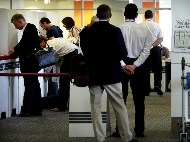 generic of people voting at the International airport in Sydney . pic: renee nowytarger 7/9/04