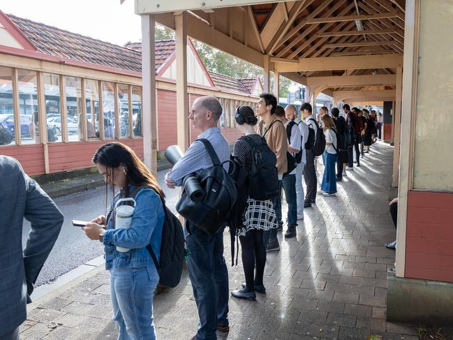 Commuters waiting at Watson St bus stop in Neutral Bay on Wednesday morning. Picture /Thomas Lisson